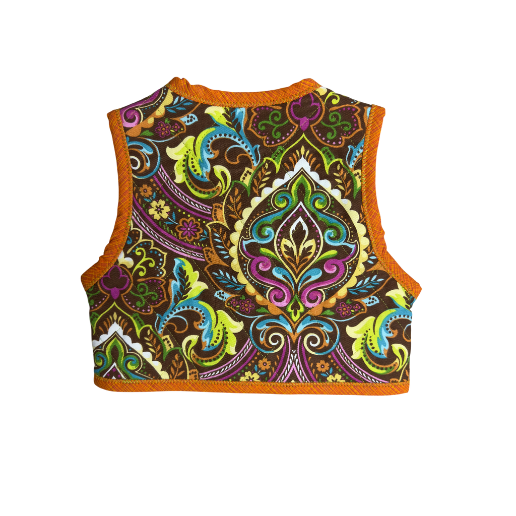 Back view of Colorful patterned Little Bright Blooms handmade multicolored floral vest with orange binding