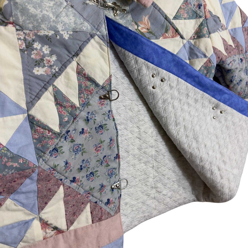 Detail of vintage quilting pattern showing soft lining and lobster clasp closings