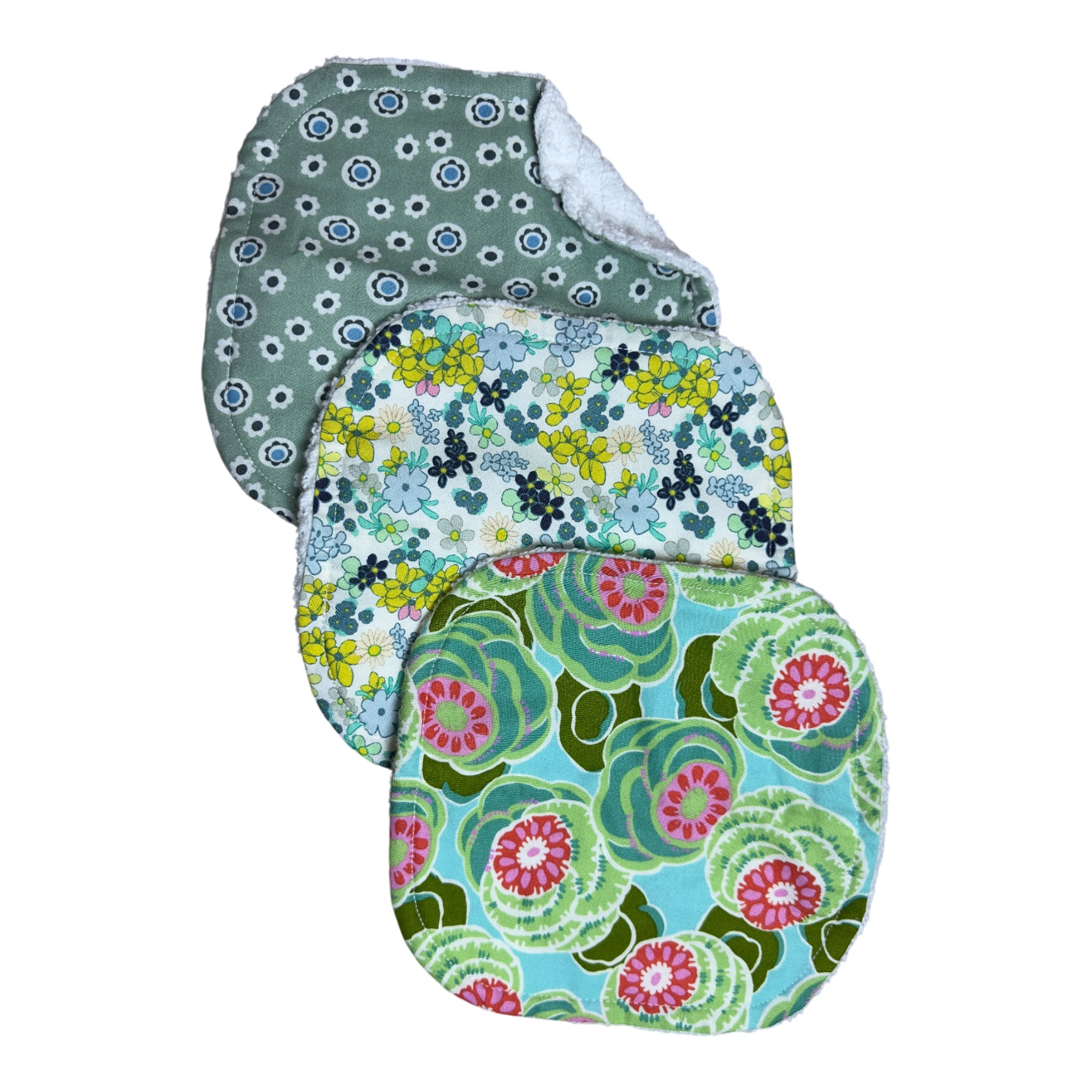 Handmade baby washcloth set of three with green-themed florals on turquoise, white, and blue backgrounds on soft terry cloth