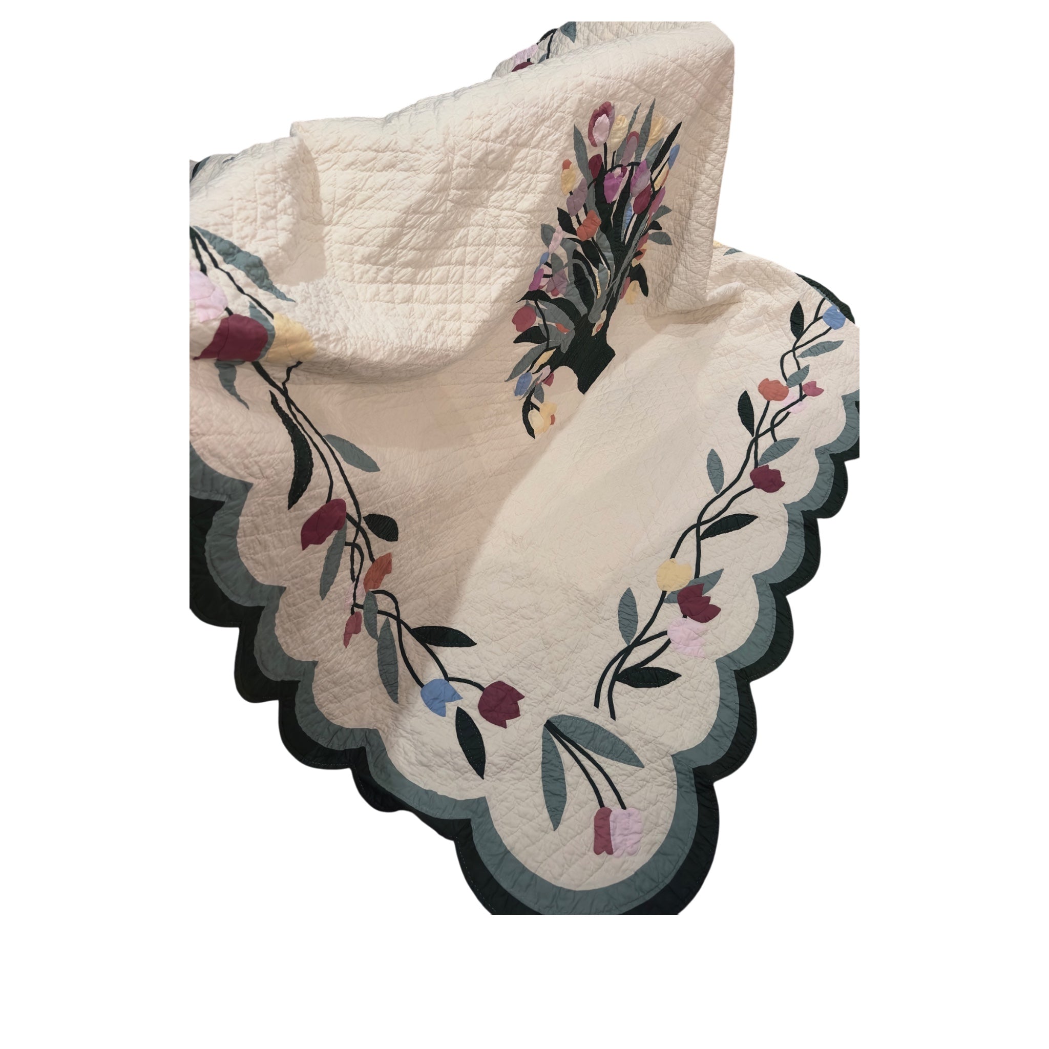 Floral quilt used to make custom jackets by Fabric & Soul.  Scalloped edge detail was used in collar. 