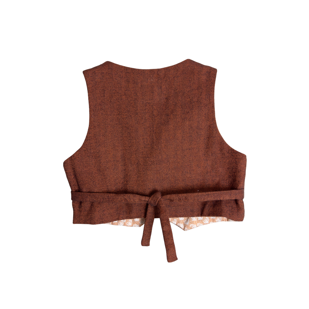Back view of handmade vest in rust color with tie for a perfect fit