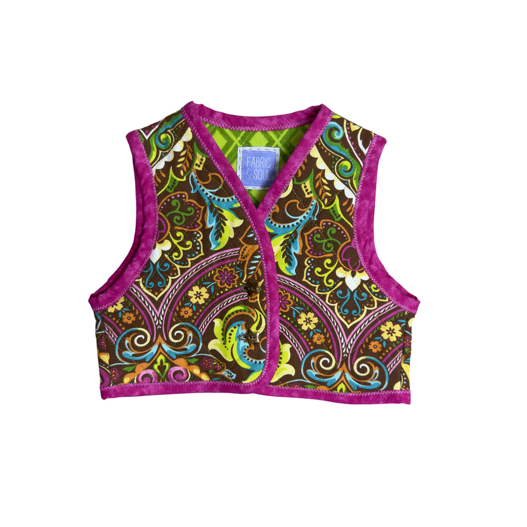 Front view of handmade quilted cotton vest in bright colors