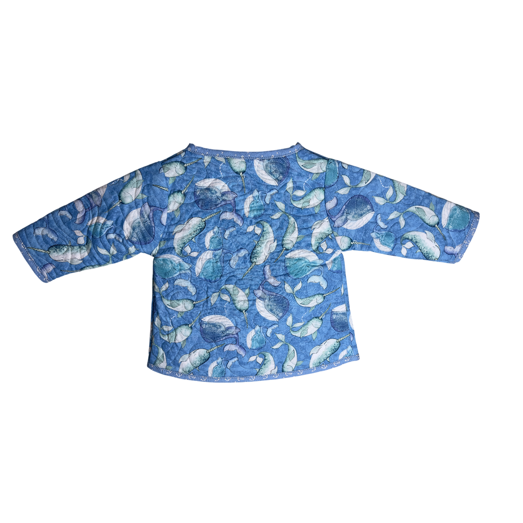 Back view of wrap and snap coat in ocean blues with Narwhals